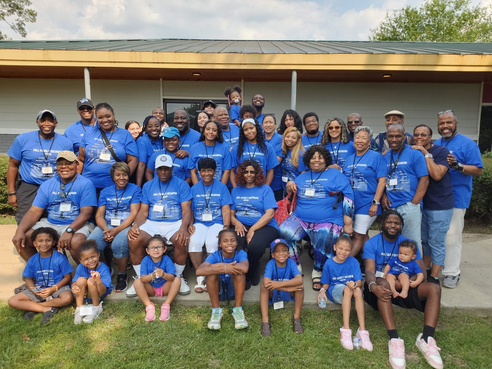 The Hill family in matching blue reunion shirts, posed for a group photo at the Memphis reunion in 2025